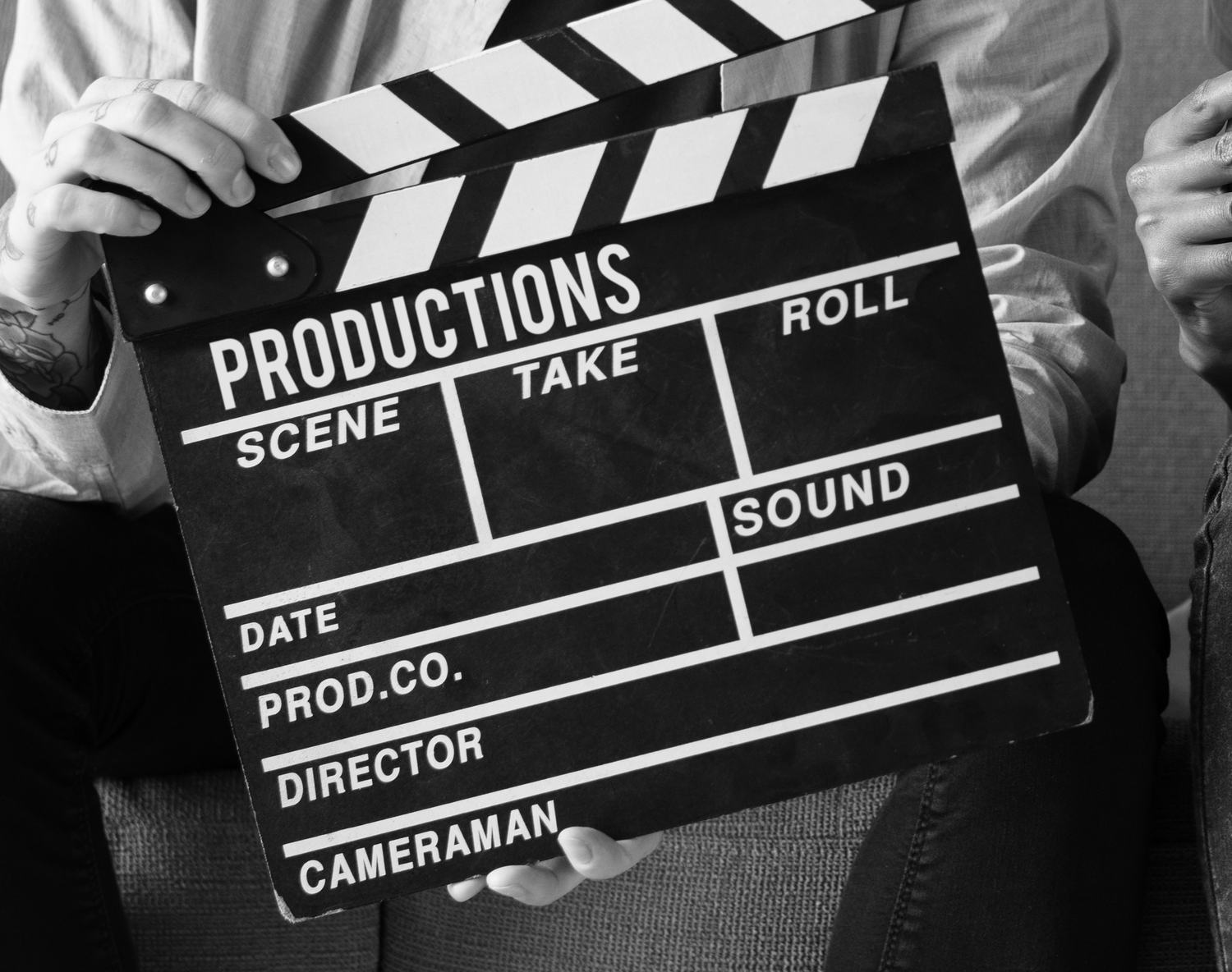 A clapperboard held open