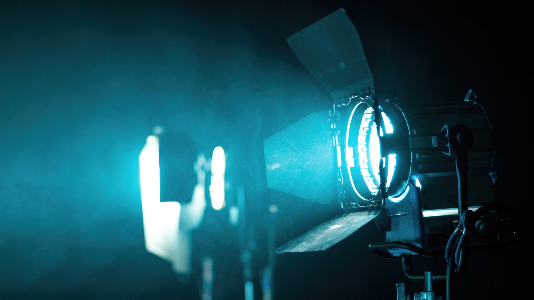 A film light glowing in smoke